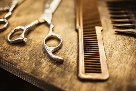 Combs And Scissors For Haircuts Lie On A Shelf In The Cabin Stock Image