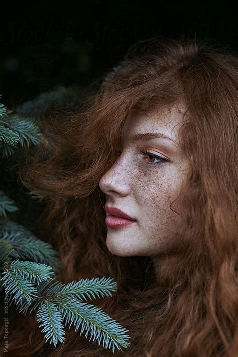 Portrait Of A Beautiful Redhead With Freckles By Stocksy Contributor