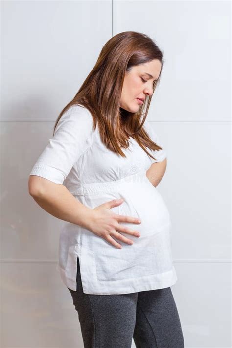 Pregnant Woman With Strong Pain Massaging Her Back Stock Photo Image