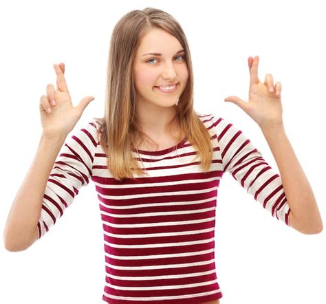 premium photo portrait of smiling girl crossing her fingers