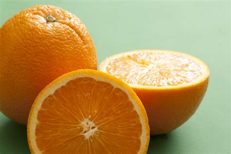 One Whole And Cut Orange Free Stock Image