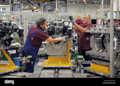 Employees Assemble An Engine At The Mercedes Benz Factory