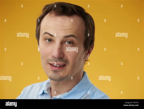 Russian White Guy Headshot Smiling On Yellow Color Background Stock