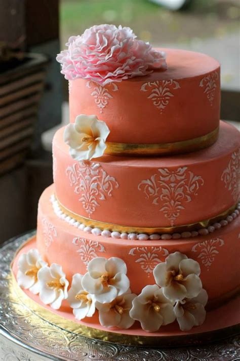 Coral Colored Wedding Cake With Blush Stenciling Gold Accents And A