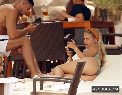 molly mae hague and tommy fury relaxing cala basa beach club during their summer holiday in