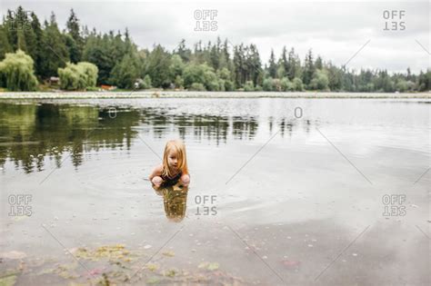 Young Girl Playing In A Lake Stock Photo Offset