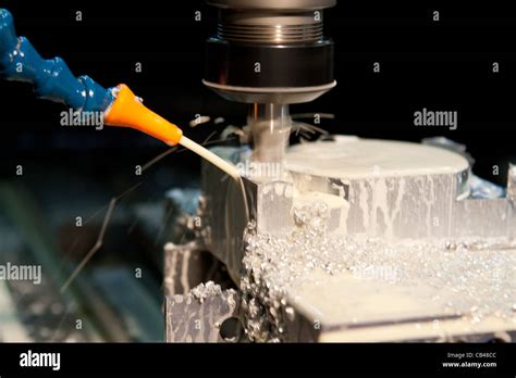 Cnc Milling Machine Cutting With Coolant Stock Photo Alamy