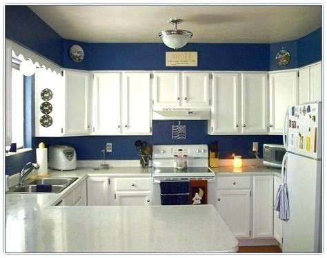 Just the right amount of color. Blue kitchen walls Ideas Dark Blue Kitchen White Cabinets ...