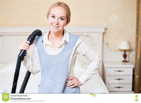 Hotel Service Female Housekeeping Worker With Vacuum Cleaner Stock