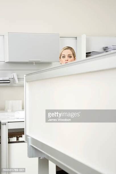 Woman Peeping Over Office Cubicle Photos And Premium High Res Pictures Getty Images