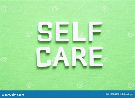 Self Care Word Abstract Quote On Wooden Blocks Over Green Background
