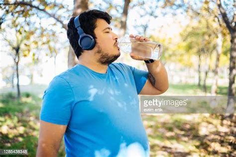 Overweight Man Drinking Water Photos And Premium High Res Pictures