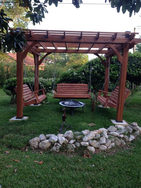 This is fire pit is great for entertaining and will become the focal point of your yard. Great outdoor area with pergola, swings and fire pit ...