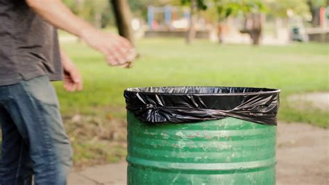 Throwing Away Garbage In Public Trash Can Stock Footage Video 10758917