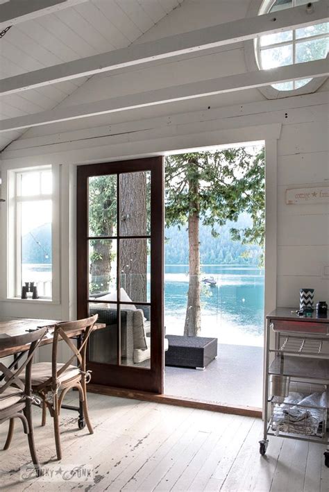 An Oval Transom Window In A Peaked Planked Vaulted Ceiling In A Dreamy