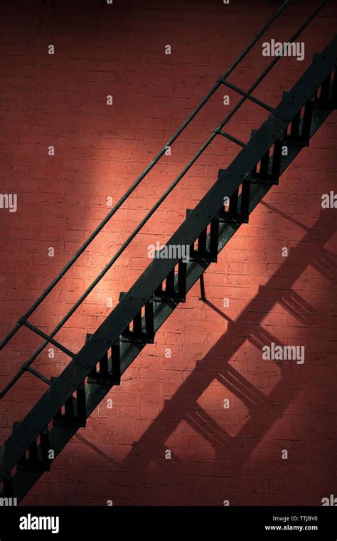 Ladder Against Brick Wall Stock Photo Alamy
