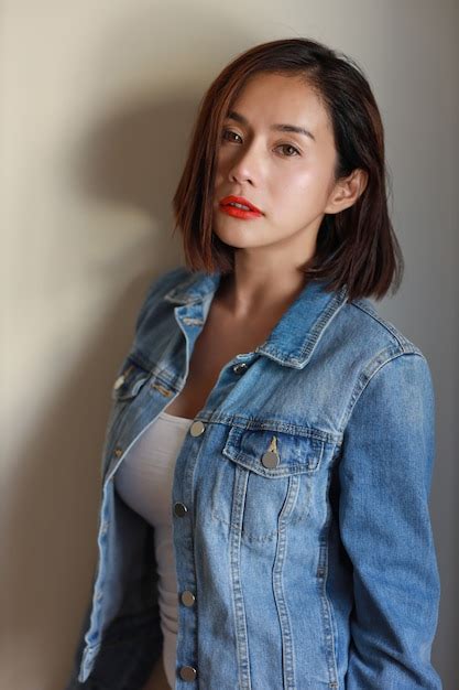 Front View Young Adult Asian Sexy Woman Red Lip And Short Hair In Blue