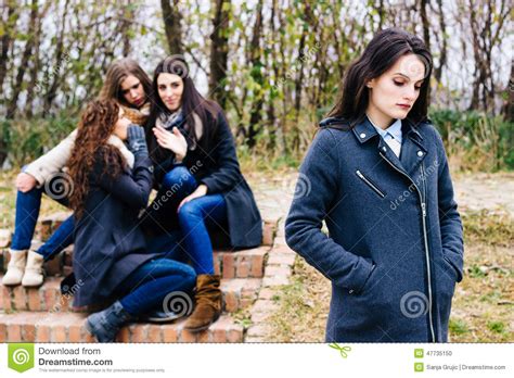Sad Girl With Friends Gossiping Stock Photo Image Of Facial