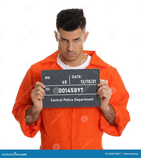 Mug Shot Of Prisoner In Orange Jumpsuit With Board On White Background