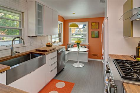 This mid century modern kitchen have rustic attraction in the wooden wall and wooden flooring with reclaimed oak wood. 5 Ways To Make Your Midcentury Modern Kitchen Layout Better