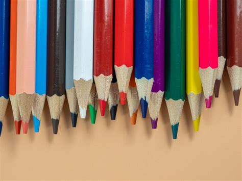 Colored Pencils On An Orange Background Stock Image Image Of Yellow