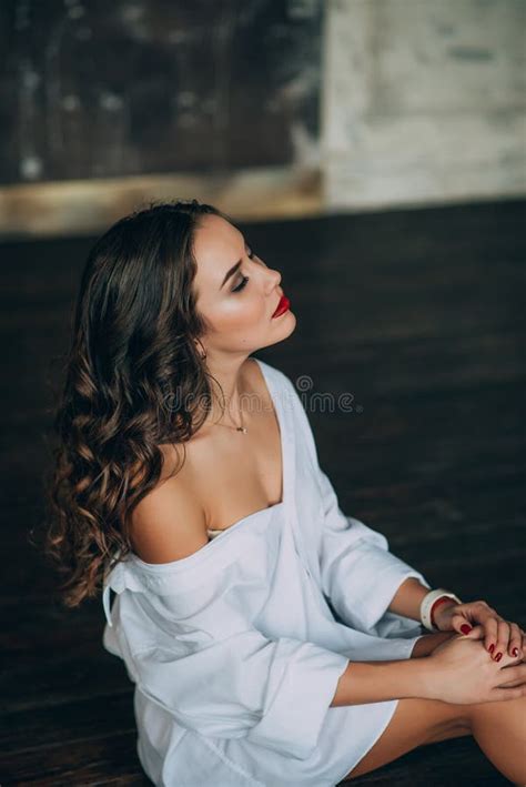 Fashionable Young Woman With Perfect Dark Curly Hair And Beautiful Make