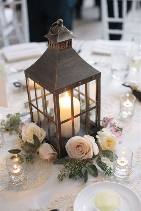 Love The Idea Of Pink Roses And Babys Breath Around The Lantern