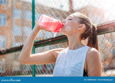 Fitness Athlete Young Woman Drinking Water After Work Out Exercising