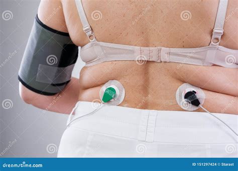 Woman With Holter Monitor Device For Daily Monitoring Of