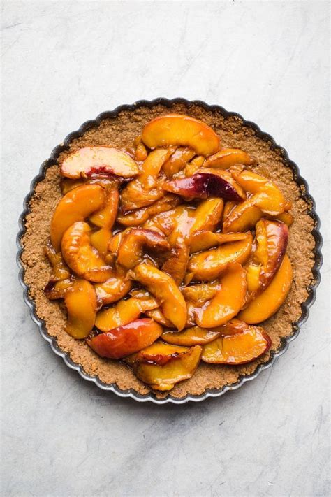 roasted peach tart made with a gluten free graham cracker crust peaches roasted with coconut