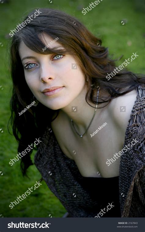 Outdoor Portrait Of A Beautiful Young Woman With Dark Hair