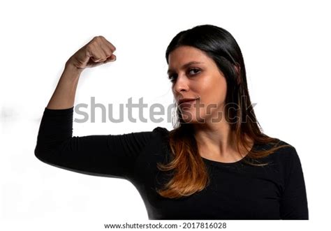 Confident Young Woman Flexes Bicep Showing Stock Photo 2017816028