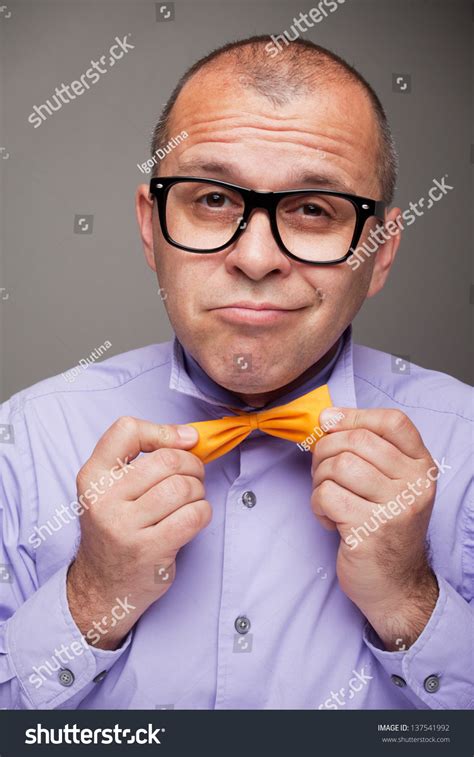 Funny Man With Glasses Checking His Outfit Stock Photo