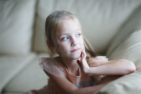 Portrait Of A Blond Girl With Blue Eyes Beautiful Child Thoughtfull
