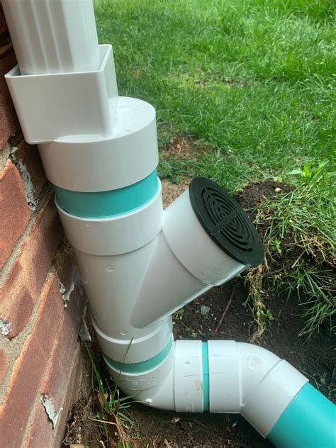 Gutter Downspout Piped Underground In Pvc To Drain Away Home