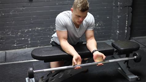 Palms Up Barbell Wrist Curl Over A Bench Exercise Guides