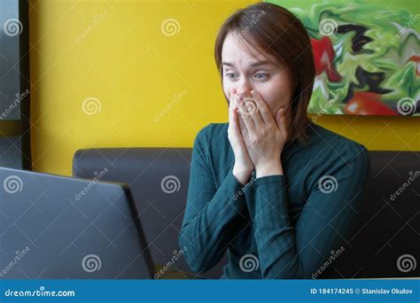 Girl With A Perplexed Surprised Tense Expression Sits Sitting Working