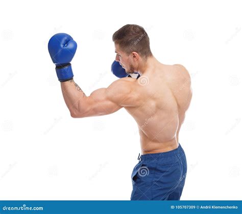Muscular Guy In Boxing Glove Punches An Uppercut On A White Isolated Background Side View Stock