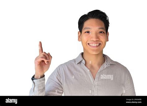 Handsome Young Healthy Asian Man Smiling With His Finger Pointing