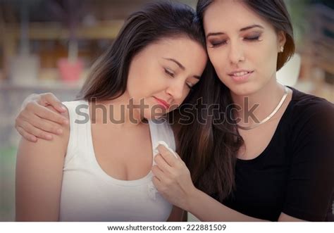 Young Woman Comforting Tearful Friend Portrait Stock Photo 222881509