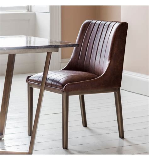 Porter leather dining chairs this type of product is a small, space saving armchair that provides comfort thanks to its soft seat. Clayton Dining Chairs Cognac Faux Leather (Pair) | FADS