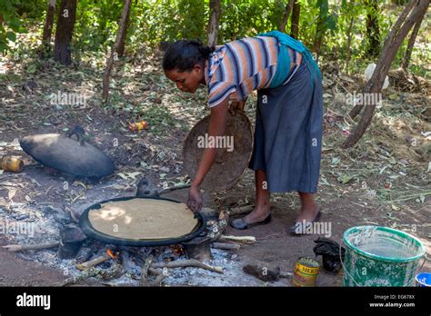 A Young Woman Making Injera Ethiopian Flat Bread Lalibela Ethiopia