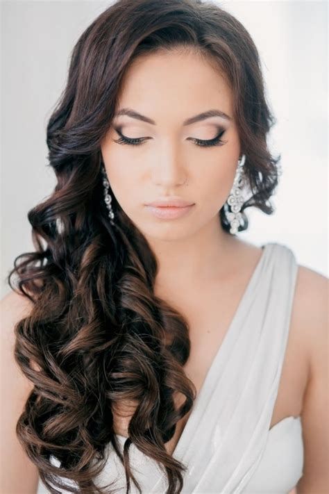 Loosely braid your curls, and then add sparkly hair pins for a curly wedding hairstyle that's equal parts boho and glam. 10 Curly and Wavy Wedding Hairstyles