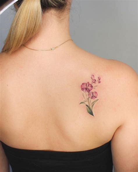 Orchids tattoo on the right shoulder blade - Tattoogrid.net | Blade