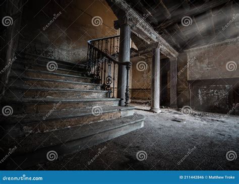 Dark Creepy Old Basement With Stone Staircase Leading To Cellar