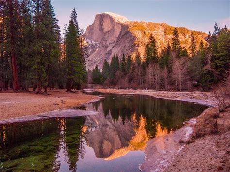 Half Dome Reflecting On The Merced River In Yosemite National Park