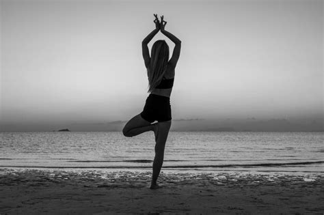 Premium Photo Silhouette Of Woman Standing At Yoga Pose On The Tropical Beach During Sunset