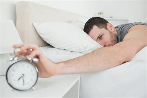 Sleeping Man Being Awakened By An Alarm Clock Stock Image Image Of