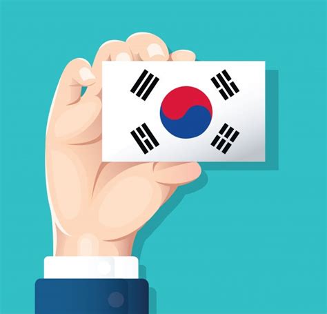 Mano Que Sostiene La Tarjeta De Bandera De Corea Del Sur Vector Premium