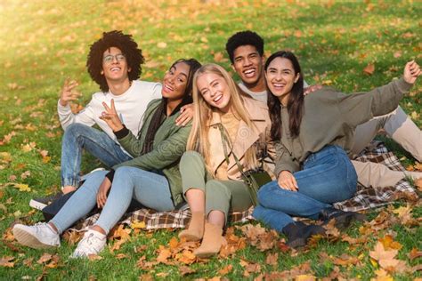 Cheerful Multiethnic Group Of Teen Friends Having Fun Outdoor Stock